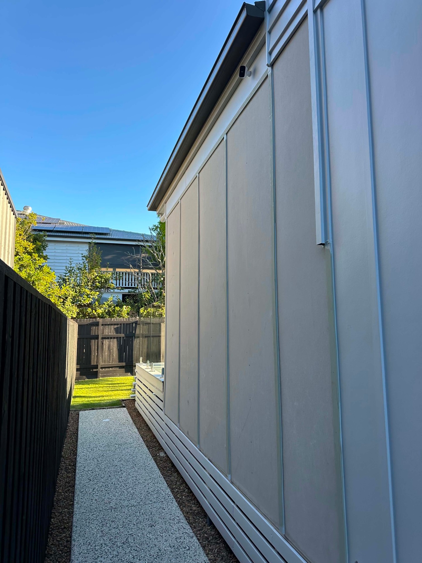 Cement-sheet cladding to a side elevation